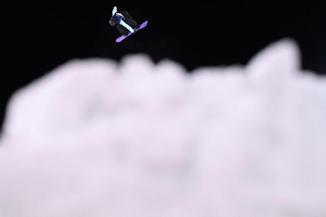 Austria's Hanna Karrer competes in the snowboard women's big air qualification run 3 at Livigno Snow Park during the Milano Cortina 2026 Winter Olympic Games, in Livigno (Valtellina), on February 8, 2026. (Photo by Kirill KUDRYAVTSEV / AFP)