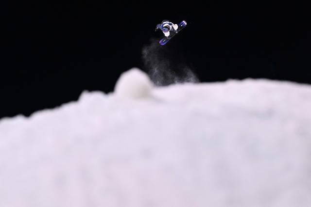 Japan's Kokomo Murase competes in the snowboard women's big air qualification run 3 at Livigno Snow Park during the Milano Cortina 2026 Winter Olympic Games, in Livigno (Valtellina), on February 8, 2026. (Photo by Kirill KUDRYAVTSEV / AFP)