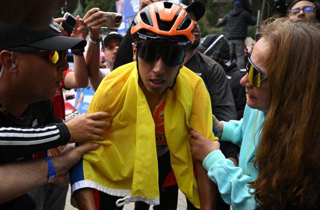 Colombian cyclist Egan Bernal celebrates after crossing the finish line to win the National Road Cycling Championships in Zipaquira, Colombia on February 8, 2026. (Photo by Raul ARBOLEDA / AFP)