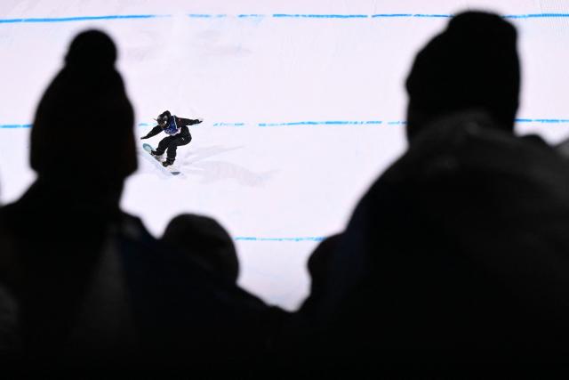 China's Zhang Xiaonan competes in the snowboard women's big air qualification run 3 at Livigno Snow Park during the Milano Cortina 2026 Winter Olympic Games, in Livigno (Valtellina), on February 8, 2026. (Photo by Kirill KUDRYAVTSEV / AFP)