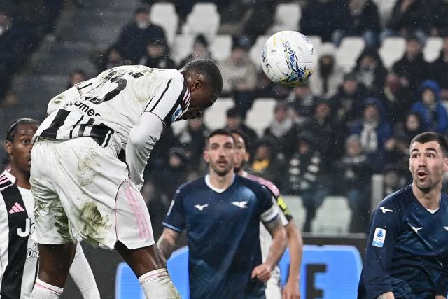 Juventus' French defender #15 Pierre Kalulu Kyatengwa heads the ball during the Italian Serie A football match Juventus AND Lazio at the Allianz stadium in Turin on February 8, 2026. (Photo by Isabella BONOTTO / AFP)