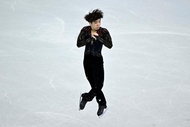 Japan's Shun Sato competes in the figure skating men's singles free skating team event during the Milano Cortina 2026 Winter Olympic Games at Milano Ice Skating Arena in Milan on February 8, 2026. (Photo by JULIEN DE ROSA / AFP)