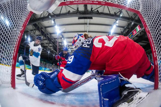 Czech Republic's #29 Klara Peslarova makes a save from a shot by Finland's #91 Julia Liikala during the women's preliminary round Group A Ice Hockey match between Czech Republic and Finland at the Milano Rho Ice Hockey Arena at the Milano Cortina 2026 Winter Olympic Games in Milan, on February 8, 2026. (Photo by Sun Fei / AFP)