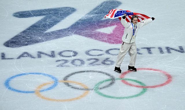 Gold medallist USA's Ilia Malinin celebrates following the podium ceremony of the figure skating team event during the Milano Cortina 2026 Winter Olympic Games at Milano Ice Skating Arena in Milan on February 8, 2026. (Photo by JULIEN DE ROSA / AFP)
