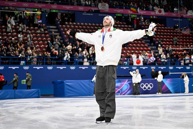 Bronze medallist Italy's Niccolo Macii pose poses following the podium ceremony of the figure skating team event during the Milano Cortina 2026 Winter Olympic Games at Milano Ice Skating Arena in Milan on February 8, 2026. (Photo by WANG Zhao / AFP)