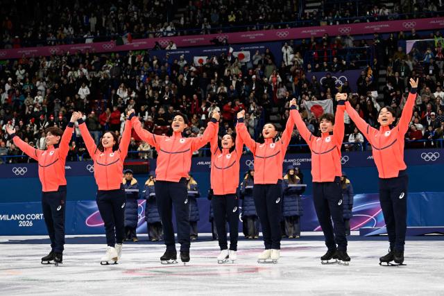 Silver medallists Japan's Utana Yoshida, Japan's Masaya Morita, Japan's Riku Miura, Japan's Ryuichi Kihara, Japan's Kaori Sakamoto, Japan's Shun Sato celebrate following the figure skating team event during the Milano Cortina 2026 Winter Olympic Games at Milano Ice Skating Arena in Milan on February 8, 2026. (Photo by WANG Zhao / AFP)