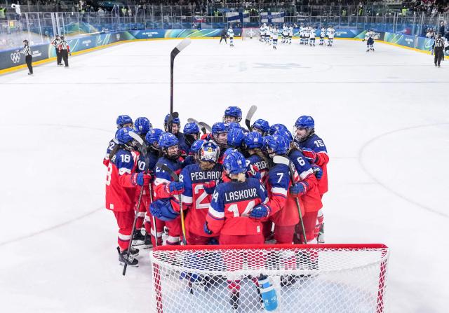 Czech Republic's players celebrate after the women's preliminary round Group A Ice Hockey match between Czech Republic and Finland at the Milano Rho Ice Hockey Arena at the Milano Cortina 2026 Winter Olympic Games in Milan, on February 8, 2026. (Photo by POOL / AFP)
