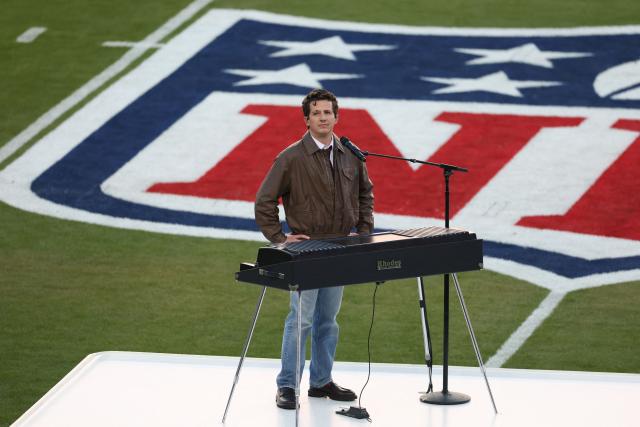 US singer-songwriter Charlie Puth stands at the keyboard as US singer songwriter Brandi Carlile (off stage) performs "America the Beautiful" ahead of Super Bowl LX between the New England Patriots and Seattle Seahawks at Levi’s Stadium in Santa Clara, California on February 8, 2026. (Photo by Patrick T. Fallon / AFP)