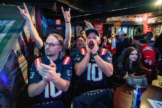 New England Patriots fans react to the opening moments of Super Bowl LX, between the New England Patriots and the Seattle Seahawks in Boston, Massachusetts, on February 8, 2026. (Photo by Joseph Prezioso / AFP)