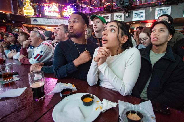 New England Patriots fans react to the opening moments of Super Bowl LX, between the New England Patriots and the Seattle Seahawks in Boston, Massachusetts, on February 8, 2026. (Photo by Joseph Prezioso / AFP)