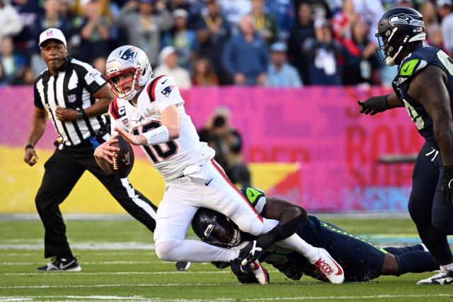 New England Patriots’ quarterback #10 Drake Maye is tackled by Seattle Seahawks’ linebacker #58 Derick Hall during Super Bowl LX between the New England Patriots and the Seattle Seahawks at Levi's Stadium in Santa Clara, California on February 8, 2026. (Photo by JOSH EDELSON / AFP)