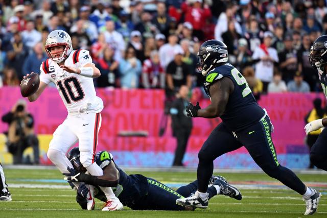 New England Patriots’ quarterback #10 Drake Maye is tackled by Seattle Seahawks’ linebacker #58 Derick Hall during Super Bowl LX between the New England Patriots and the Seattle Seahawks at Levi's Stadium in Santa Clara, California on February 8, 2026. (Photo by JOSH EDELSON / AFP)