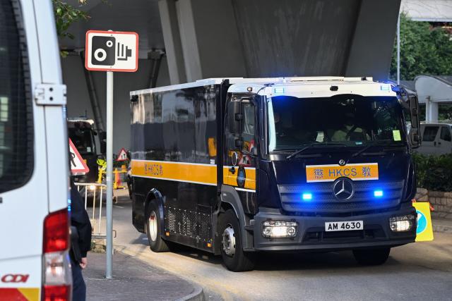 A correctional services vehicle in a convoy believed to be transporting convicted pro-democracy media tycoon Jimmy Lai arrives at the West Kowloon Magistrates' court in Hong Kong on February 9, 2026. Hong Kong pro-democracy media tycoon Jimmy Lai will be sentenced on February 9 over national security crimes that could see him jailed for life, with some rights groups and Western nations still demanding his release. (Photo by Peter PARKS / AFP)