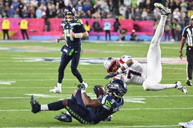 Seattle Seahawks’ running back #09 Kenneth Walker III is stopped by New England Patriots’ cornerback #07 Carlton Davis III while rushing the ball during Super Bowl LX between the New England Patriots and the Seattle Seahawks at Levi's Stadium in Santa Clara, California on February 8, 2026. (Photo by JOSH EDELSON / AFP)