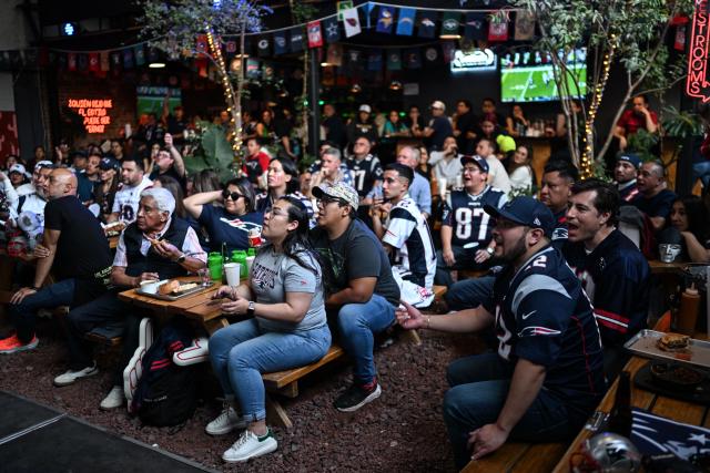 Supporters of the New England Patriots watch the Super Bowl LX between the New England Patriots and the Seattle Seahawks at a restaurant in Mexico City on February 8, 2026. (Photo by Yuri CORTEZ / AFP)