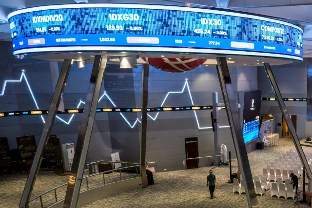 A ticker screen for stock market movements is seen at the trading floor of the Indonesia Stock Exchange ahead of the day's activities in Jakarta on February 9, 2026. (Photo by BAY ISMOYO / AFP)