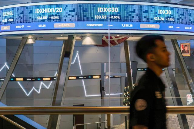 A ticker screen for stock market movements is seen at the trading floor of the Indonesia Stock Exchange ahead of the day's activities in Jakarta on February 9, 2026. (Photo by BAY ISMOYO / AFP)