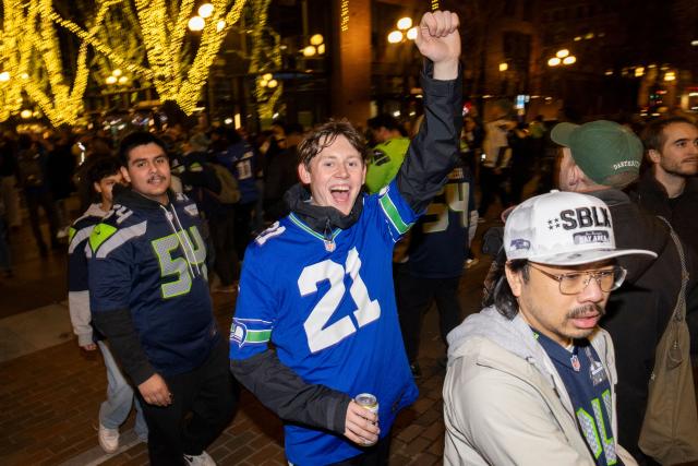 Seattle Seahawks fans celebrate in Pioneer Square after the Seahawks defeated the New England Patriots to win Super Bowl LX, in Seattle, Washington, on February 8, 2026. (Photo by Jason Redmond / AFP)