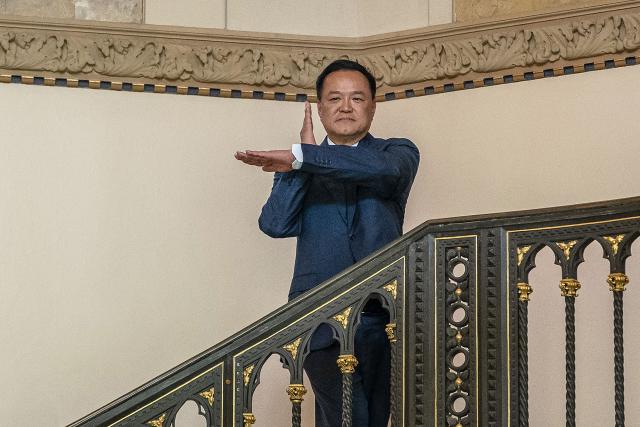 Thai Prime Minister Anutin Charnvirakul poses as he arrives at the Government House in Bangkok on February 9, 2026. Thailand's caretaker premier Anutin Charnvirakul was preparing for coalition talks after his conservative Bhumjaithai Party surged to a stunning election victory on a wave of nationalism. (Photo by chanakarn laosarakham / AFP)