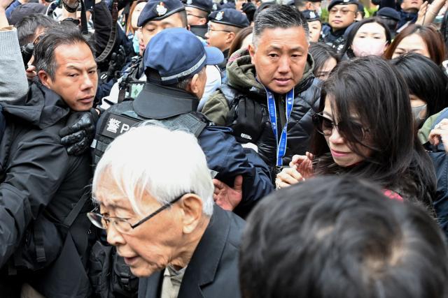 Teresa Lai (R), wife of convicted pro-democracy media tycoon Jimmy Lai, and Joseph Zen (front), retired cardinal of the Catholic Church, leave the West Kowloon Magistrates Court following Jimmy Lai's sentencing in Hong Kong on February 9, 2026. A Hong Kong court on February 9 sentenced pro-democracy media mogul Jimmy Lai to 20 years in prison following his high-profile national security trial that rights groups and Western nations have condemned as a symbol of the city's shrivelling press freedoms. (Photo by Peter PARKS / AFP)