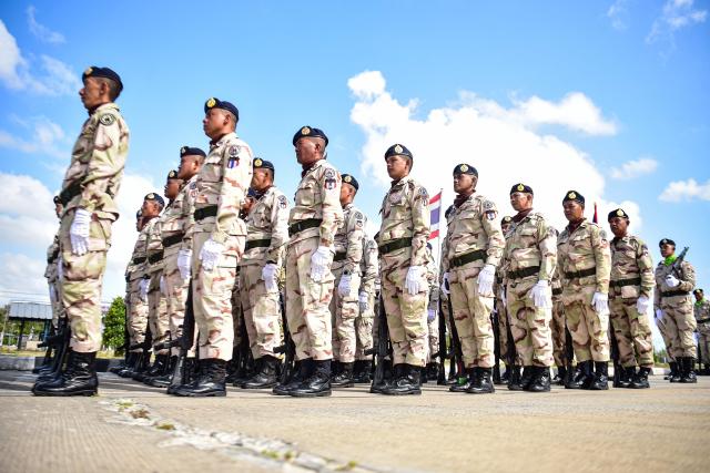 Thai civilian defence volunteers take part in a parade on the eve of the annual Defence Volunteers Day in Narathiwat, southern Thailand on February 9, 2026. (Photo by Madaree TOHLALA / AFP)