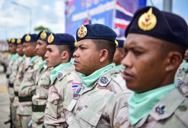Thai civilian defence volunteers take part in a parade on the eve of the annual Defence Volunteers Day in Narathiwat, southern Thailand on February 9, 2026. (Photo by Madaree TOHLALA / AFP)