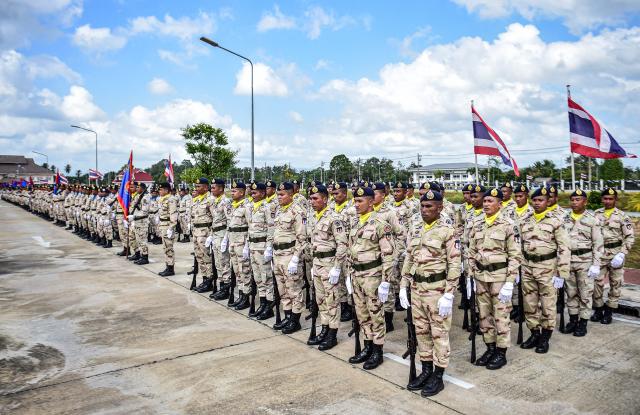 Thai civilian defence volunteers take part in a parade on the eve of the annual Defence Volunteers Day in Narathiwat, southern Thailand on February 9, 2026. (Photo by Madaree TOHLALA / AFP)