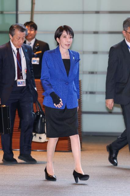 Japan's Prime Minister Sanae Takaichi enters the Prime Minister's Office in Tokyo on February 9, 2026. Japanese shares rose to record highs on February 9 after Prime Minister Sanae Takaichi's conservatives won a historic election landslide with a projected two-thirds majority. (Photo by JIJI Press / AFP) / Japan OUT