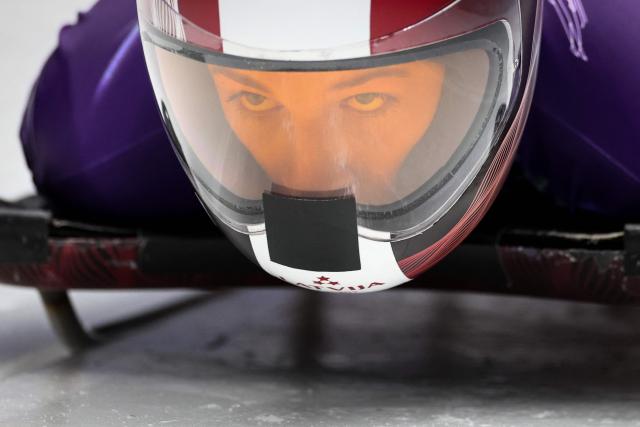 Latvia's Marta Andzane takes part in the skeleton women's training session at Cortina Sliding Centre during the Milano Cortina 2026 Winter Olympic Games in Cortina d'Ampezzo on February 9, 2026. (Photo by FRANCK FIFE / AFP)