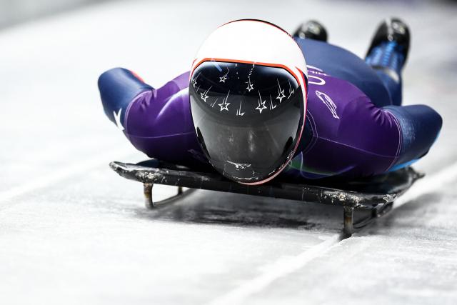 USA's Kelly Curtis takes part in the skeleton women's training session at Cortina Sliding Centre during the Milano Cortina 2026 Winter Olympic Games in Cortina d'Ampezzo on February 9, 2026. (Photo by FRANCK FIFE / AFP)