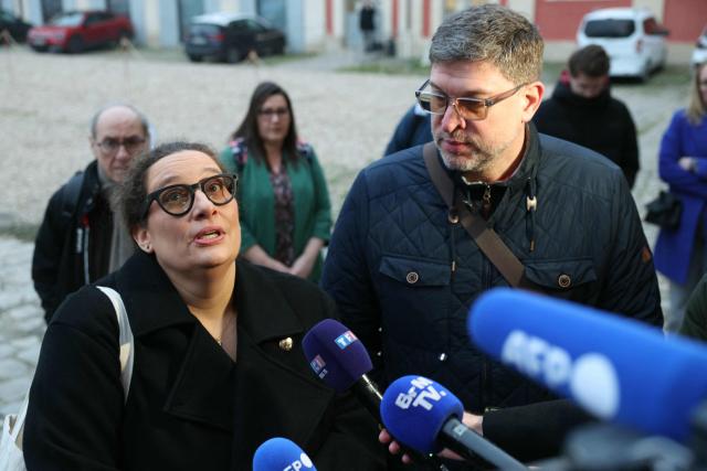 Evaelle's parents speak to the press as they arrive for the appeal trial of a teacher for harassment after Evaelle, a 11 year-old-middle school student committed suicide, at Versailles courthouse, on February 9, 2026. The appeal was requested by the public prosecutor, who had sought an 18-month suspended prison sentence for Evaelle's teacher. The schoolgirl hanged herself in her bedroom at her family home in Herblay in June 2019. (Photo by Alain JOCARD / AFP)