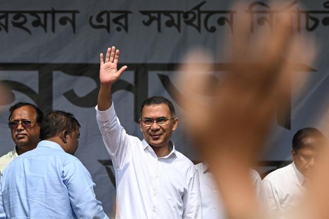 Tarique Rahman (C), Bangladesh Nationalist Party (BNP) chairman and election candidate, waves to supporters upon his arrival at a rally on the final day of campaigning ahead of the country's general election in Dhaka on February 9, 2026. (Photo by Sajjad HUSSAIN / AFP)