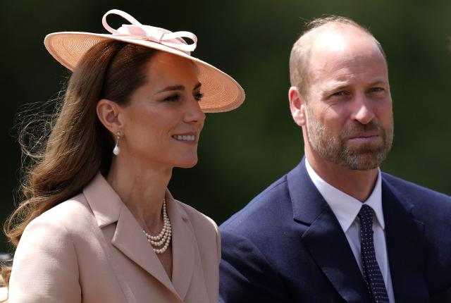 (FILES) Britain's Catherine (L), Princess of Wales and Britain's Prince William, Prince of Wales travel in the Ascot Landau carriage during a carriage precession at Windsor Castle, in Windsor west of London on July 8, 2025. Prince William and his wife Catherine have been "deeply concerned" by the latest revelations linking William's uncle Andrew Mountbatten-Windsor to late US sex offender Jeffrey Epstein, Kensington Palace said on February 9, 2026. (Photo by Andrew Matthews / AFP)