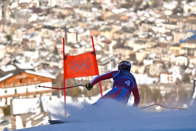 France's Maxence Muzaton competes in the downhill run of the men's team combined alpine skiing event during the Milano Cortina 2026 Winter Olympic Games at the Stelvio Ski Centre in Bormio (Valtellina) on February 9, 2026. (Photo by Fabrice COFFRINI / AFP)