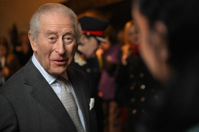 Britain's King Charles III meets guests during a visit to the 700-year-old medieval manor Samlesbury Hall in Preston, north-west England on February 9, 2026. (Photo by Paul ELLIS / POOL / AFP)