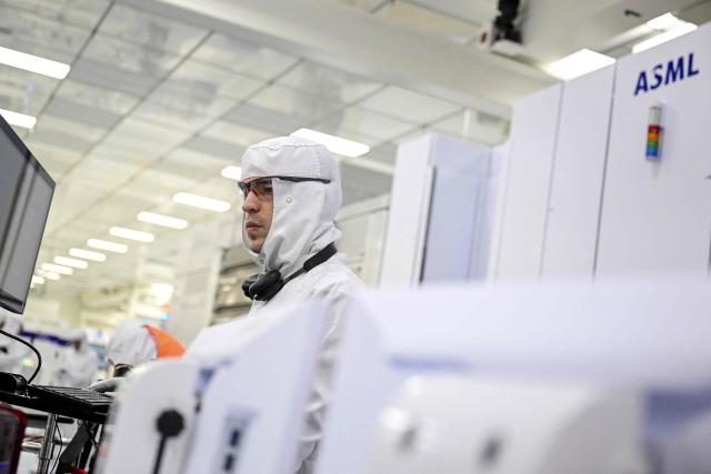 This photograph taken on February 9, 2026, shows a technician working at the new NanoIC pilot line in the IMEC research and development center for nanoelectronics and digital technologies during his inauguration in Leuven, Monday 09 February 2026. (Photo by DIRK WAEM / Belga / AFP) / Belgium OUT