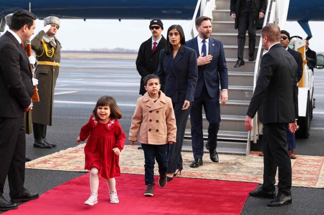 U.S. Vice President JD Vance (C,R), his wife Usha Vance (C) and their children Mirabel and Vivek walk from Air Force Two upon arrival in Yerevan on February 9, 2026. US Vice President JD Vance is due to kick off a visit to Armenia on February 9, 2026 before travelling to Azerbaijan the next day, US officials said, as Washington seeks to consolidate a US-brokered peace process between the neighbours. (Photo by Kevin Lamarque / AFP)