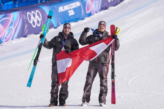 Tied Silver medallists Austria's Manuel Feller and Austria's Vincent Kriechmayr pose after the men's team combined alpine skiing event during the Milano Cortina 2026 Winter Olympic Games at the Stelvio Ski Centre in Bormio (Valtellina) on February 9, 2026. (Photo by Dimitar DILKOFF / AFP)