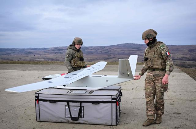 French soldiers operate a surveillance drone during the Dynamic Front 26 military exercise at the Cincu Training Area in Cincu, Romania, on February 9, 2026. Dynamic Front 26 is the largest U.S. Army-led artillery exercise ever conducted in Europe, bringing together NATO allies to rehearse the Eastern Flank Deterrence Line through high-tech coordination across land, air, sea, and cyber domains. The exercise tests the speed of decision-making and cross-border strike capabilities through live-fire drills. Dynamic Front 26 runs from January 26 to February 13, 2026. (Photo by Daniel MIHAILESCU / AFP)