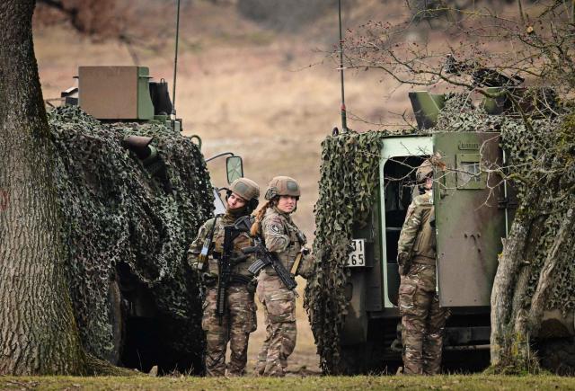 French soldiers attend the Dynamic Front 26 military exercise at the Cincu Training Area in Cincu, Romania, on February 9, 2026. Dynamic Front 26 is the largest U.S. Army-led artillery exercise ever conducted in Europe, bringing together NATO allies to rehearse the Eastern Flank Deterrence Line through high-tech coordination across land, air, sea, and cyber domains. The exercise tests the speed of decision-making and cross-border strike capabilities through live-fire drills. Dynamic Front 26 runs from January 26 to February 13, 2026. (Photo by Daniel MIHAILESCU / AFP)