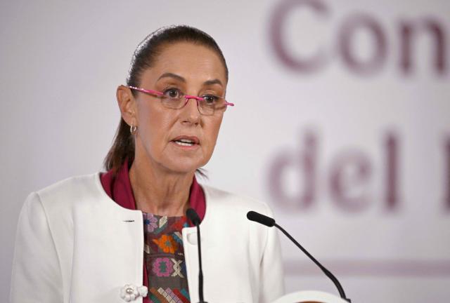 (FILES) Mexico's President Claudia Sheinbaum speaks during her daily morning press conference after US strikes on Venezuela, at the National Palace in Mexico City on January 5, 2026. Mexico's President Claudia Sheinbaum on February 9 blasted US threats of tariffs on countries supplying oil to crisis-stricken Cuba, saying the measure would "strangle" the communist nation's people. (Photo by Alfredo ESTRELLA / AFP)