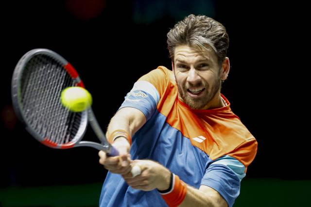 Britain's Cameron Norrie hits a return against Spain's Roberto Bautista Agut during their men's single match on the first day of the ATP Tour Rotterdam Open tennis tournament at the Ahoy Rotterdam Arena in Rotterdam on February 9, 2026. (Photo by Bas CZERWINSKI / ANP / AFP) / Netherlands OUT