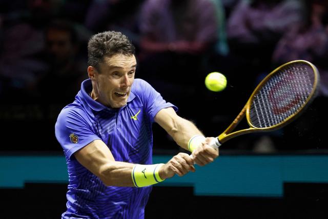 Spain's Roberto Bautista Agut hits a return against Britain's Cameron Norrie during their men's single match on the first day of the ATP Tour Rotterdam Open tennis tournament at the Ahoy Rotterdam Arena in Rotterdam on February 9, 2026. (Photo by Bas CZERWINSKI / ANP / AFP) / Netherlands OUT