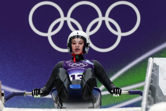Individual Neutral Athletes' Daria Olesik takes the start to compete in the luge women's singles run 1 at Cortina Sliding Centre during the Milano Cortina 2026 Winter Olympic Games in Cortina d'Ampezzo on February 9, 2026. (Photo by FRANCK FIFE / AFP)