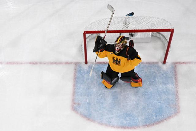 Germany's #35 Sandra Abstreiter celebrates her team's first goal during the women's preliminary round Group B Ice Hockey match between Germany and France at the Milano Rho Ice Hockey Arena at the Milano Cortina 2026 Winter Olympic Games in Milan, on February 9, 2026. (Photo by Alexander NEMENOV / AFP)