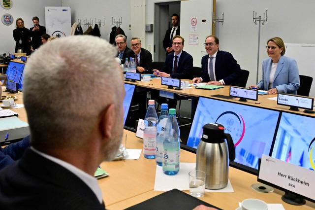 German Interior Minister Alexander Dobrindt and German Minister for Justice and Consumer Protection Stefanie Hubig (R) attend a meeting as they visit the Joint Counter-Terrorism Center (GTAZ) in Berlin on February 9, 2026. (Photo by John MACDOUGALL / AFP)