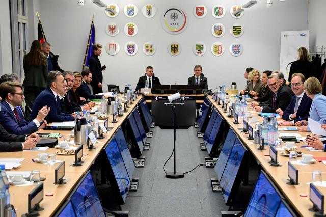 German Interior Minister Alexander Dobrindt and German Minister for Justice and Consumer Protection Stefanie Hubig (R) attend a meeting as they visit the Joint Counter-Terrorism Center (GTAZ) in Berlin on February 9, 2026. (Photo by John MACDOUGALL / AFP)