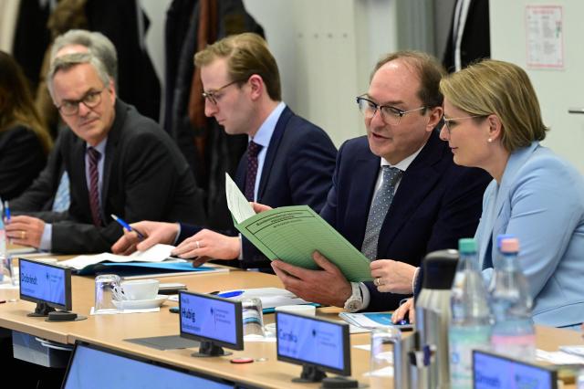 German Interior Minister Alexander Dobrindt and German Minister for Justice and Consumer Protection Stefanie Hubig (R) attend a meeting as they visit the Joint Counter-Terrorism Center (GTAZ) in Berlin on February 9, 2026. (Photo by John MACDOUGALL / AFP)