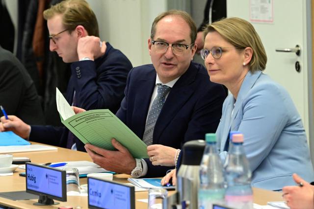 German Interior Minister Alexander Dobrindt and German Minister for Justice and Consumer Protection Stefanie Hubig attend a meeting as they visit the Joint Counter-Terrorism Center (GTAZ) in Berlin on February 9, 2026. (Photo by John MACDOUGALL / AFP)