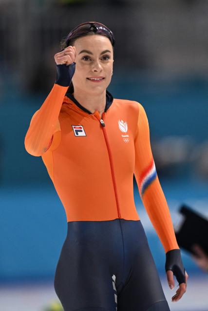 Netherlands' Femke Kok celebrates after creating an Olympic Record in the speed skating women's 1000m during the Milano Cortina 2026 Winter Olympic Games at Milano Speed Skating Stadium in Milan on February 9, 2026. (Photo by Daniel MUNOZ / AFP)